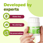 Fructaid supplement container held by a hand with green background and text about product features. 